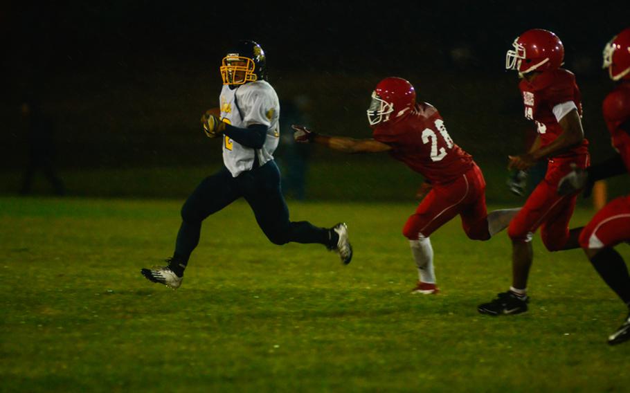 Heidelberg's Justin Rodney get's by Kaiserslautern's Albert Lee as Heidelberg defeated Kaiserlautern 18-13 Friday night.