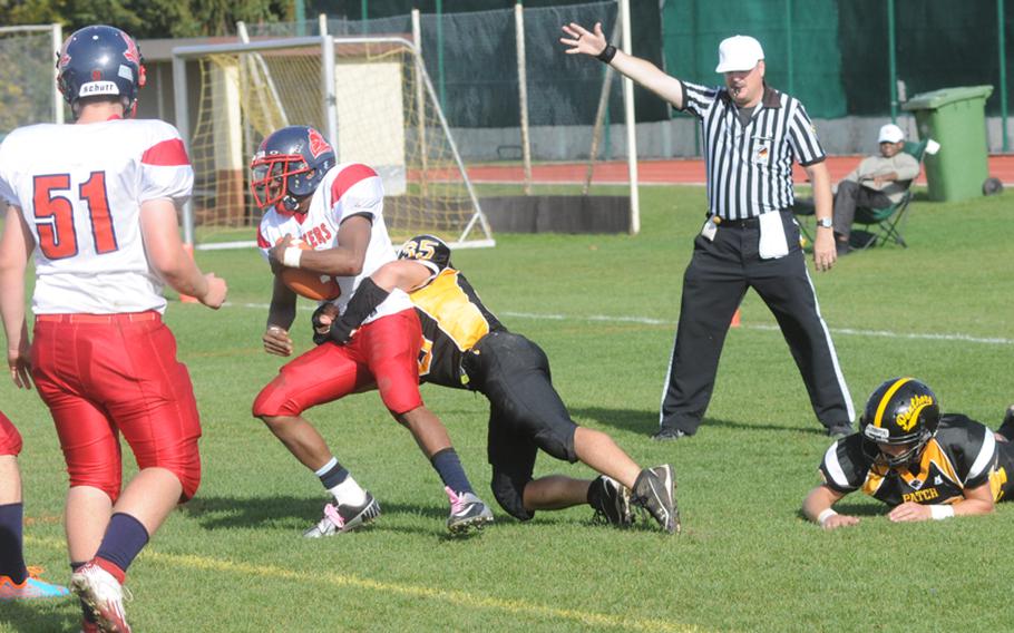Patch defender Dylan Stanko sacks Lakenheath quarterback A.J. Ransom for a safety in the first half. Stanko and his fellow Panther defenders smothered Ransom all day.