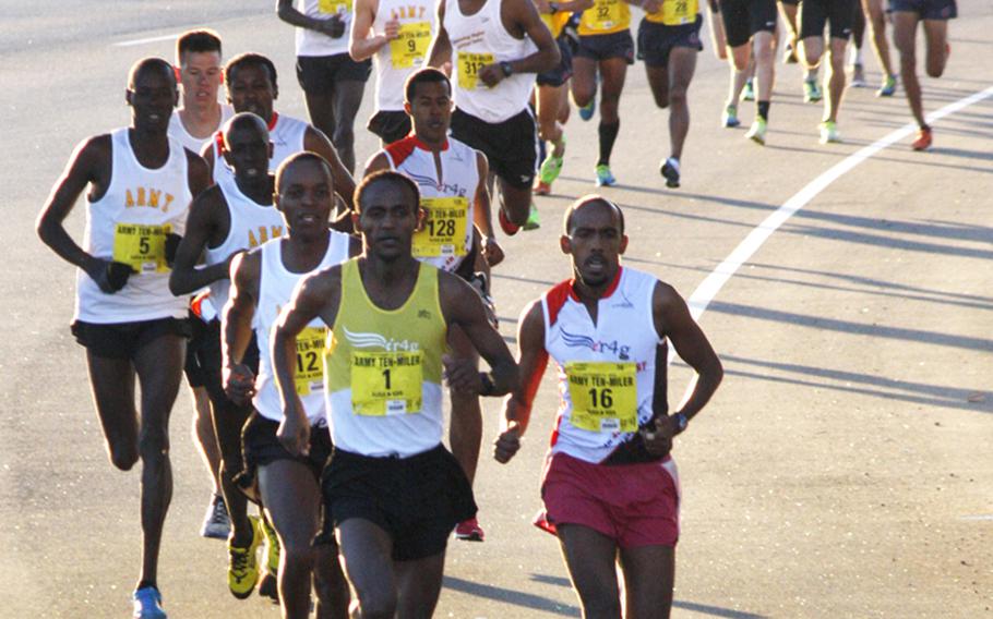 Tesfaye Sendeku Alemayehu of Ethiopia (1) takes the early lead on his way to a win in the Army Ten-Miler in Arlington, Va. and Washington, D.C.