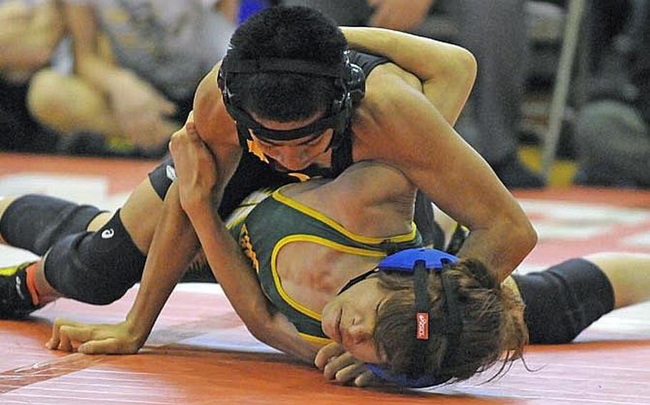 Kadena's Justin Duenas, top, defeated Robert D. Edgren's Francis Estacion at 101 pounds during last year's Far East wrestling tournament. Duenas and other wrestlers will participate in a shortened tournament this year. DODDS-Pacific announced cuts to its season-ending tournaments Friday.