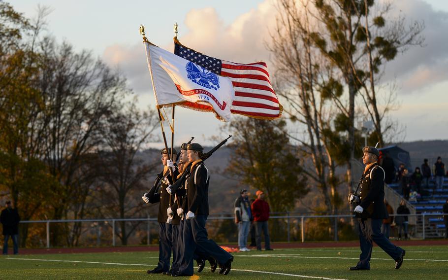 The Wiesbaden High School JROTC color guard performs Saturday night before the start of the DODDS-Europe high school football all-star game in Wiesbaden, Germany.