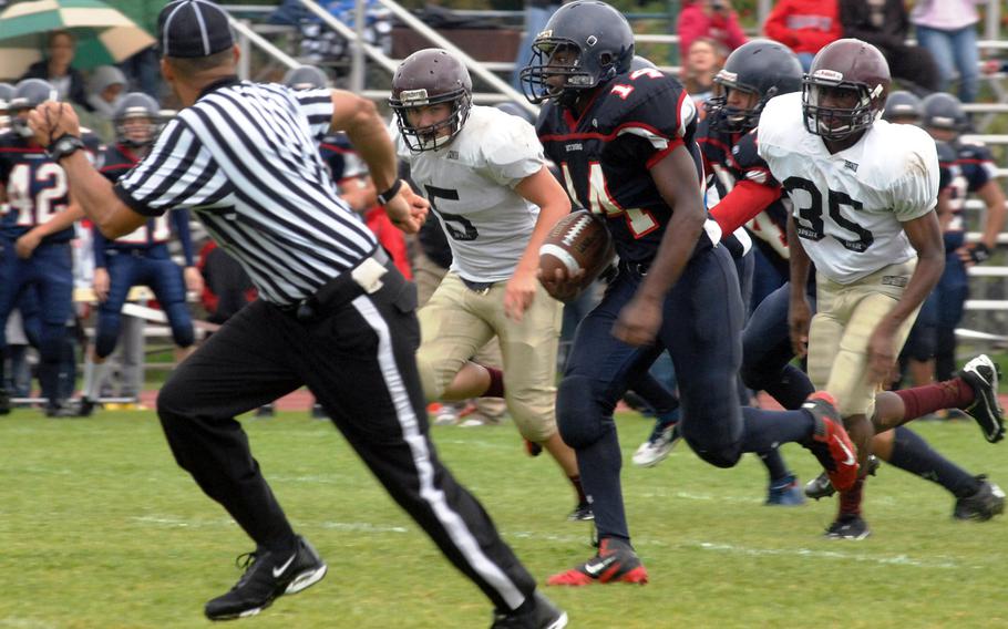 Bitburg running back Larry Jackson breaks free for a 57-yard second-quarter touchdown run against Baumholder on Saturday at Bitburg, Germany. Bitburg won the game 42-6 and set a new DODDS-Europe record with its 32nd consecutive victory. They won four more games before falling to Hohenfels in a Division II semifinal. 

