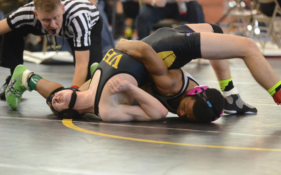 Naples' Miles Davis secures the body of Vicenza's John Salo Saturday, during a 132-pound Southern sectional qualifier match at Vicenza, Italy. Davis won 18-3 and earned a spot at the European Championship in Germany. 