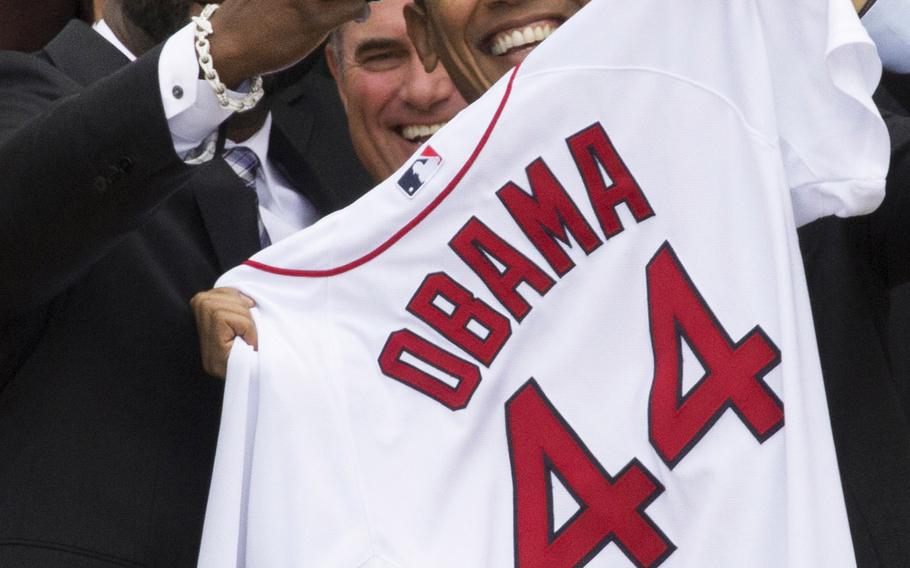 Boston Red Sox designated hitter David Ortiz takes a selfie with President Barack Obama during an April 1, 2014 ceremony at the White House in which the president honored the 2013 World Series champions.