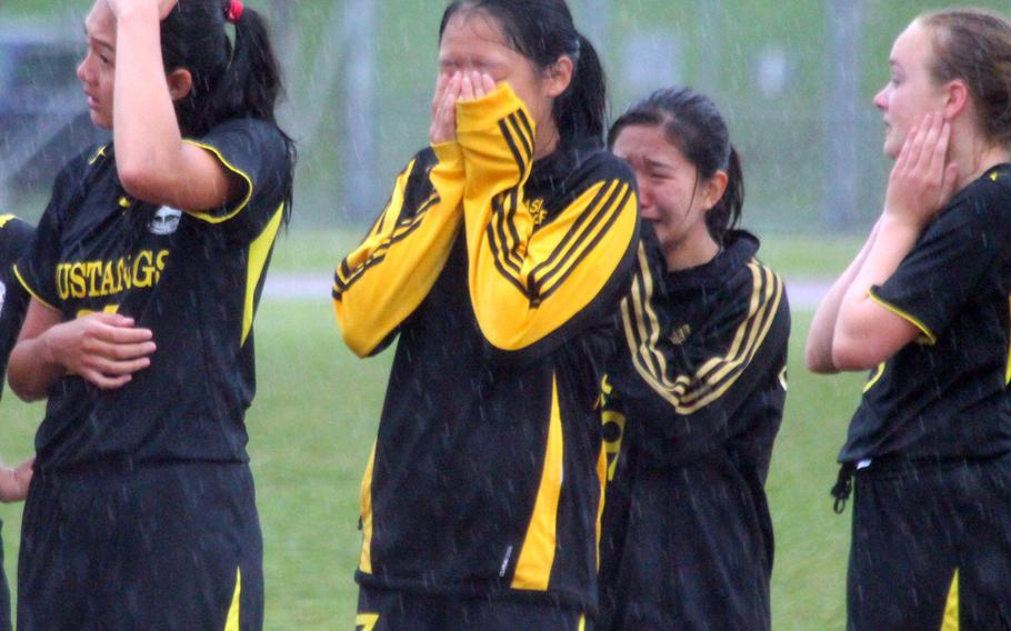 American School In  Japan girls soccer players express their emotions after losing a penalty-kick shootout to Kubasaki in the Far East Division I Tournament final Thursday.