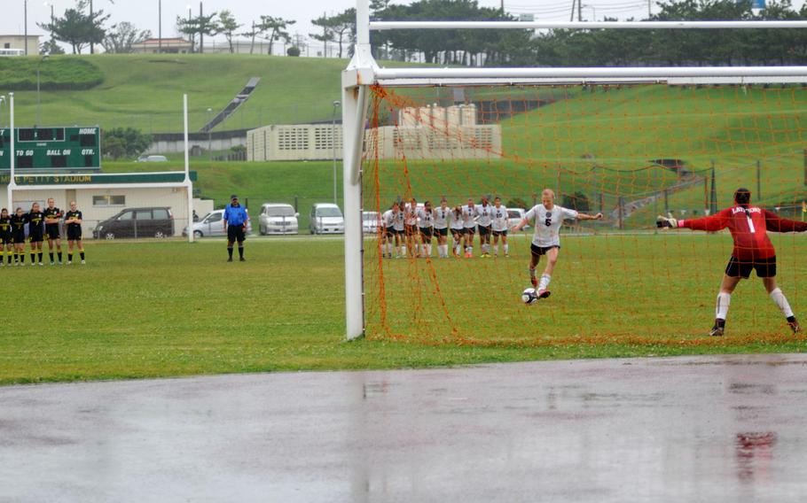 Kubasaki's Madalyn Trumble makes the winning kick against American School in Japan at the Far East Division 1 girls soccer championship at Camp Foster, Okinawa, May 22, 2014. Kubasaki won 1-0 in a shootout.