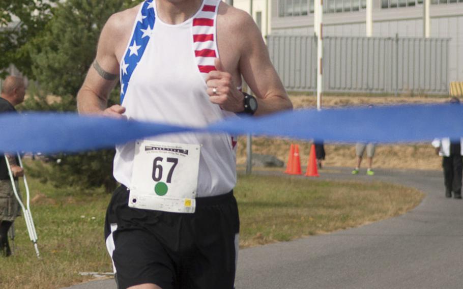 Army Capt. John King wins his second straight U.S. Forces Europe Army 10-Miler qualifier with a time of 55 minutes, 50.9 seconds. King competed against more than 200 other runners at the race held at USAG Grafenwöhr on Saturday, June 28, 2014. 