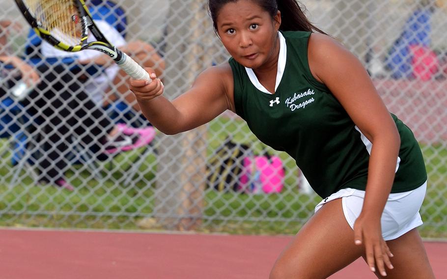 Kubasaki's top singles seed, Haley Agra, hits a forehand volley against Kadena's Lily Oliver during Tuesday's Okinawa high school tennis tie at Kubasaki High School. Oliver won 6-1, 6-0 and Kadena won a regular-season tie for the first time in three goes this season, edging the Dragons 5-4.