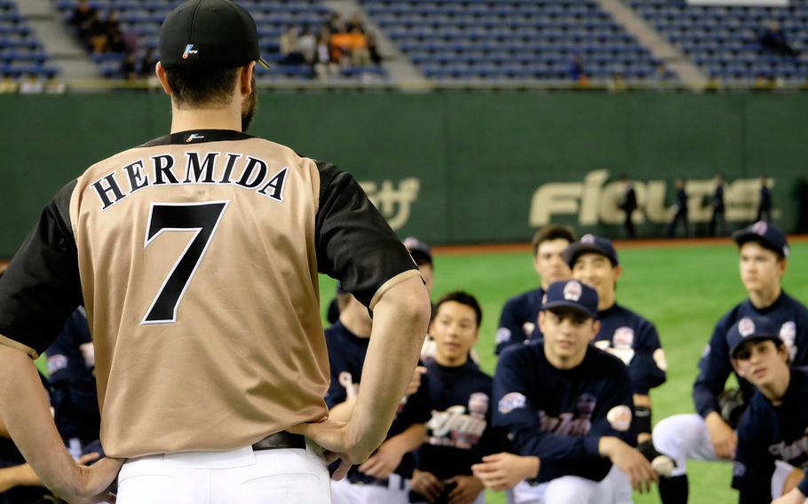 Jeremy Hermida of the Nippon Ham Fighters talks to DODDS and international school players making up Team Jeter on Saturday, March 21, 2015, at the Tokyo Dome. Hermida, a former Major League Baseball player, was the 3rd base coach for Team Jeter.