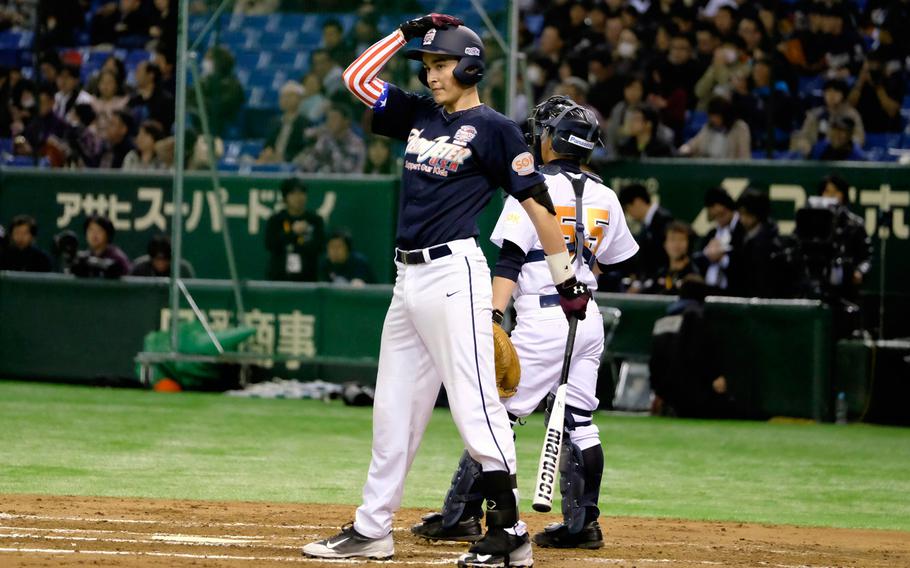 Garrett Macias, a freshman catcher from M.C. Perry High School in Iwakuni, prepares for his at-bat during the '2 with 55 Tomodachi Game' at the Tokyo Dome Saturday, March 21, 2015. The 3-inning charity game raised funds for victims of the 2011 earthquake and tsunami in northern Japan.