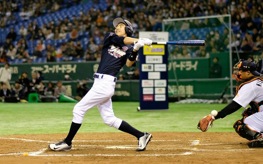 Leo Yang of American School in Japan foul tips during the home run derby portion of the '2 with 55 Tomodachi Game' at the Tokyo Dome Saturday, March 21, 2015. The 3-inning charity game that included high school baseball players, managed by Derek Jeter and Hideki Matsui, from DODDS and international schools raised funds for victims of the 2011 earthquake and tsunami in northern Japan.