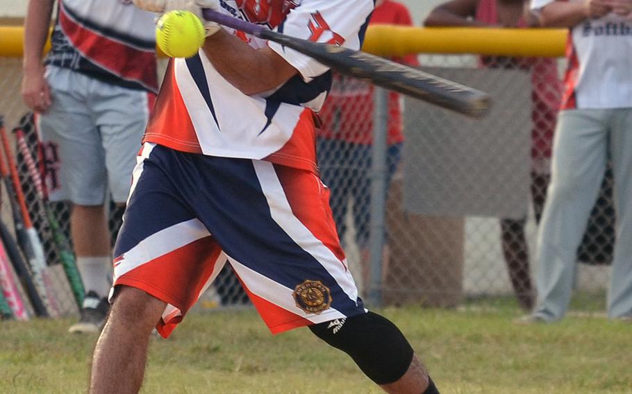 American Legion's Erik Perez connects against Pour House during Saturday's Game 1 of a two-game men's final in the Firecracker Shootout Softball Tournament. Legion scored five seventh-inning runs and won 9-4, forcing a second "if necessary" game, which Pour House won 13-12 for its second Firecracker title in three years.