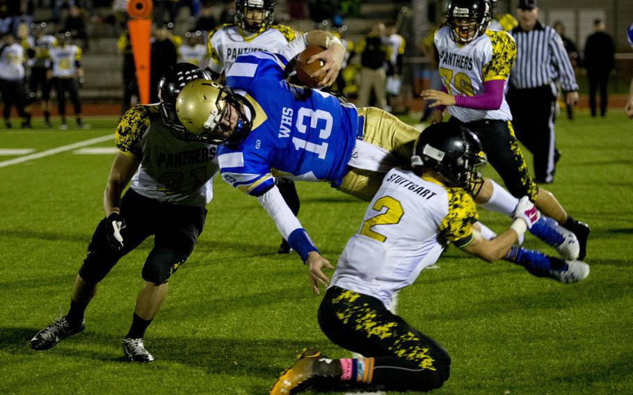 Wiesbaden Warrior Eric Arnold is taken down by Stuttgart Panther Jamie Ensley during the DODDS-Europe Division I football championship at Vogelweh, Germany, on Saturday, Nov. 7, 2015. The Warriors were defeated by the Panthers 10-7. 