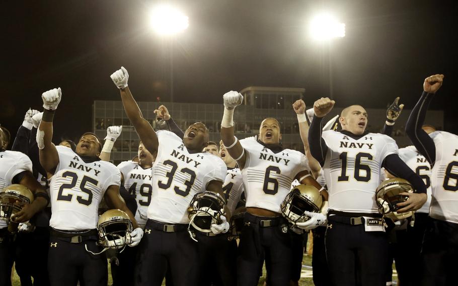 Navy celebrates after the NCAA college football against Tulsa in Tulsa, Okla., Saturday, Nov. 21, 2015. Navy defeated Tulsa 44-21.