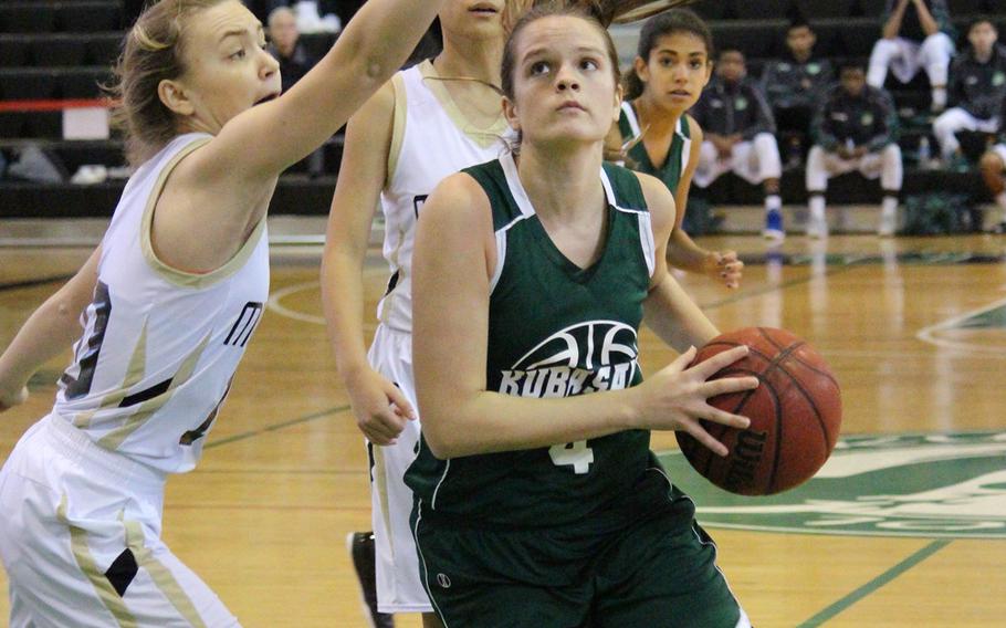 Kubasaki's Chloe Stevens penetrates the ASIJ defense during the Far East Girls Division I Tournament on Wednesday, Feb. 17, 2016 at Foster Field House in Okinawa, Japan.