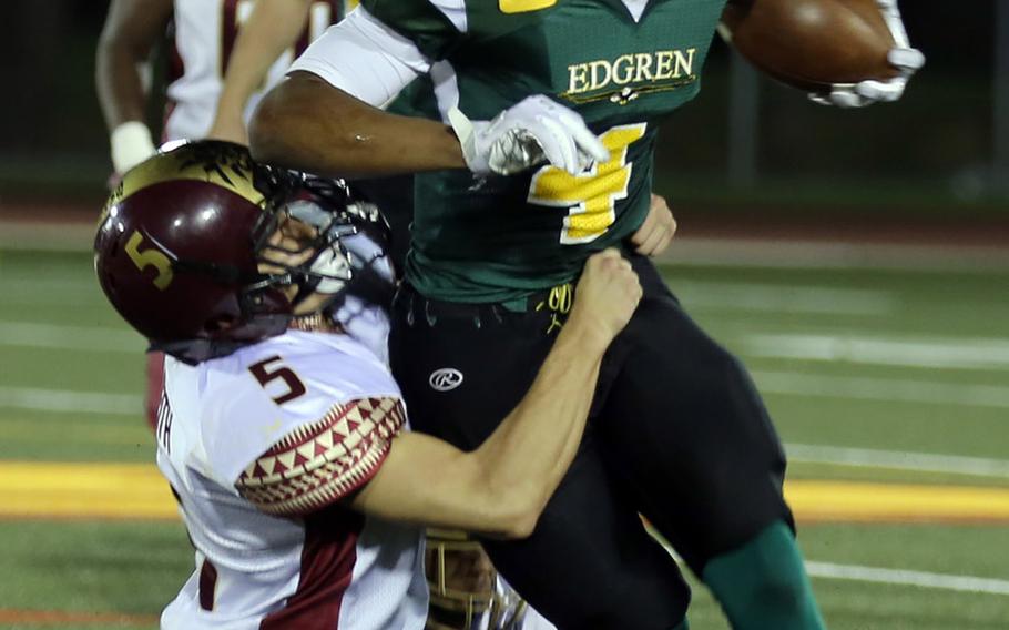 Matthew C. Perry defender John Keith wraps up Robert D. Edgren QB Patrick Sledge.