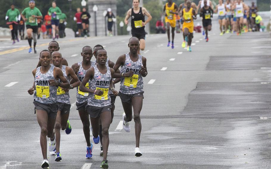 Eventual race winner Augustus Maiyo (7, at left) leads a group of fellow Army team members across the Potomac and into Washington, D.C., near the two-mile mark of the Army 10 Miler, Oct. 9, 2016.