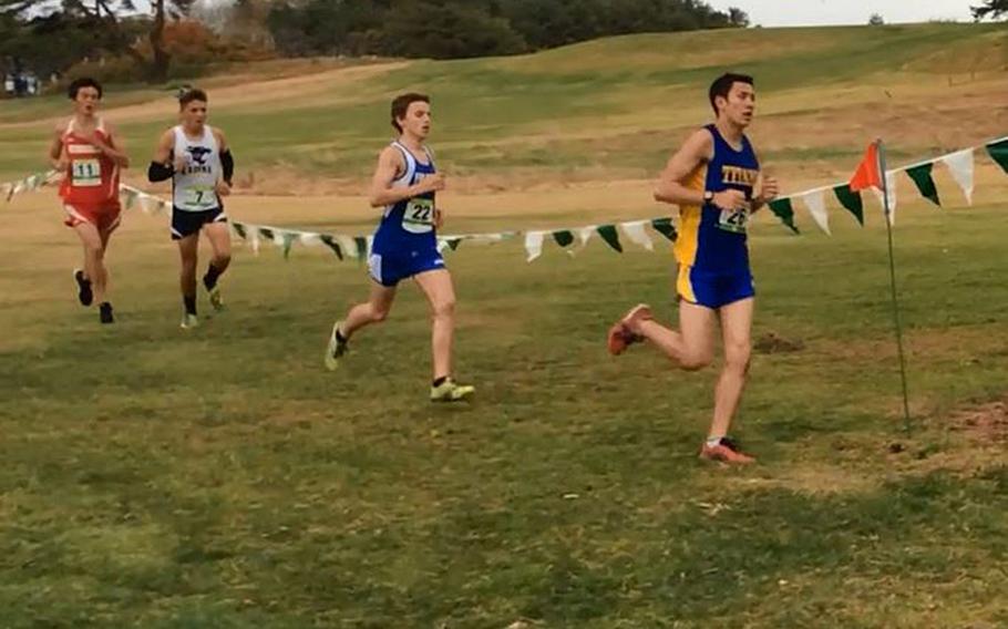 Boys Division I champion Thomas Richter leads the pack through midpoint of the race. Richter, a St. Mary's senior, ran 17:01 to capture the title.