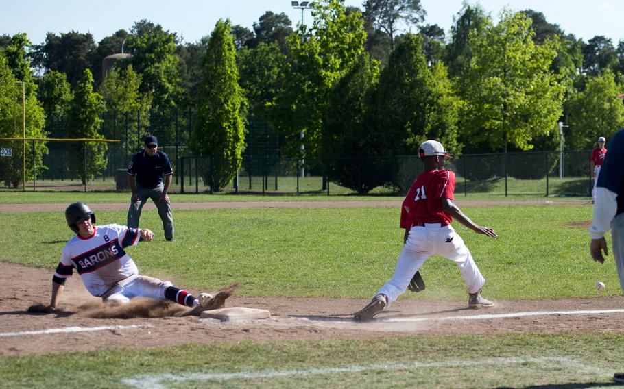 Bitburg's Max Little, left, slides into third ahead of a throw to Aviano's Ethan Lewis during the DODEA-Europe baseball tournament at Ramstein Air Base, Germany, on Thursday, May 25, 2017. Bitburg won the game 15-5.
