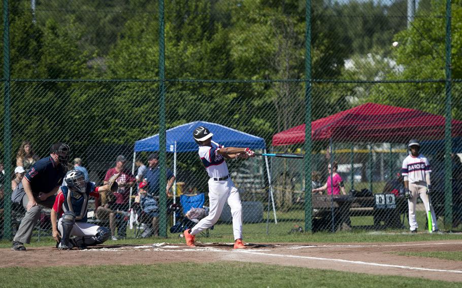Bitburg's Tyriq Zvijer hits the ball during the DODEA-Europe baseball tournament at Ramstein Air Base, Germany, on Thursday, May 25, 2017. Bitburg won the Division II/III game against Aviano 15-5.