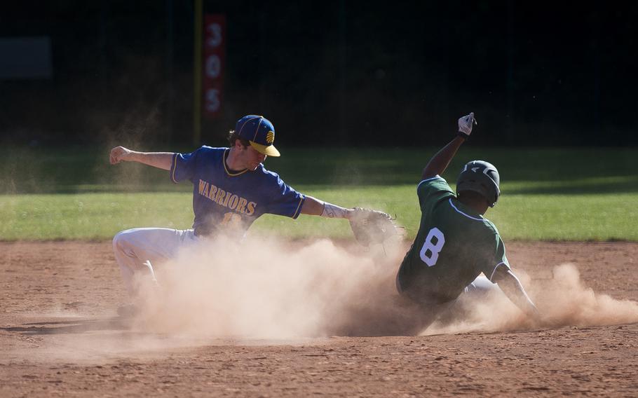 Naples' Andrew Smith slides in safe at second ahead of a tag by Wiesbaden's Gunner Yingling during the DODEA-Europe baseball tournament in Kaiserslautern, Germany, on Thursday, May 25, 2017. Naples lost the game 6-3.