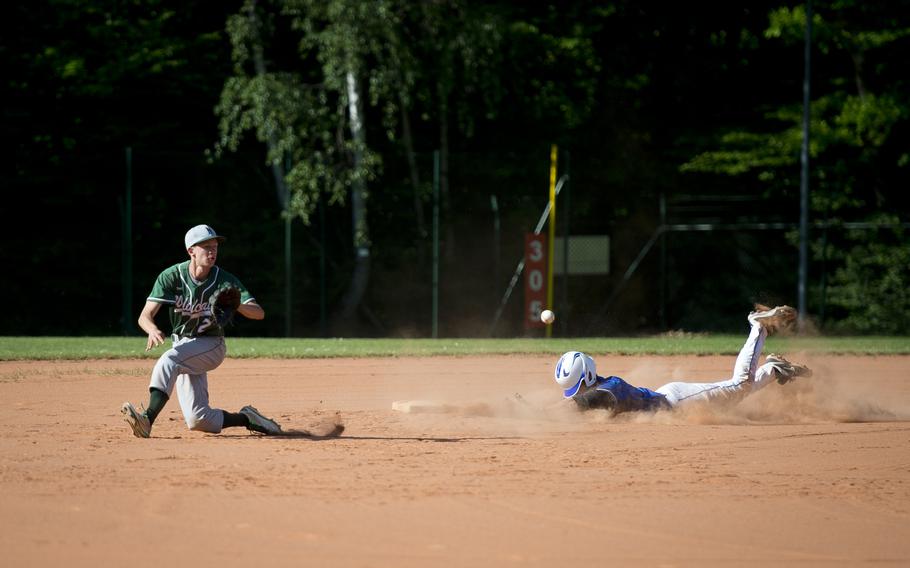 Wiesbaden's Thomas Wieland, right, slides into second ahead of a throw to Naples' Bailey Ward during the DODEA-Europe baseball tournament in Kaiserslautern, Germany, on Thursday, May 25, 2017. Wiesbaden won the Division I game 6-3.