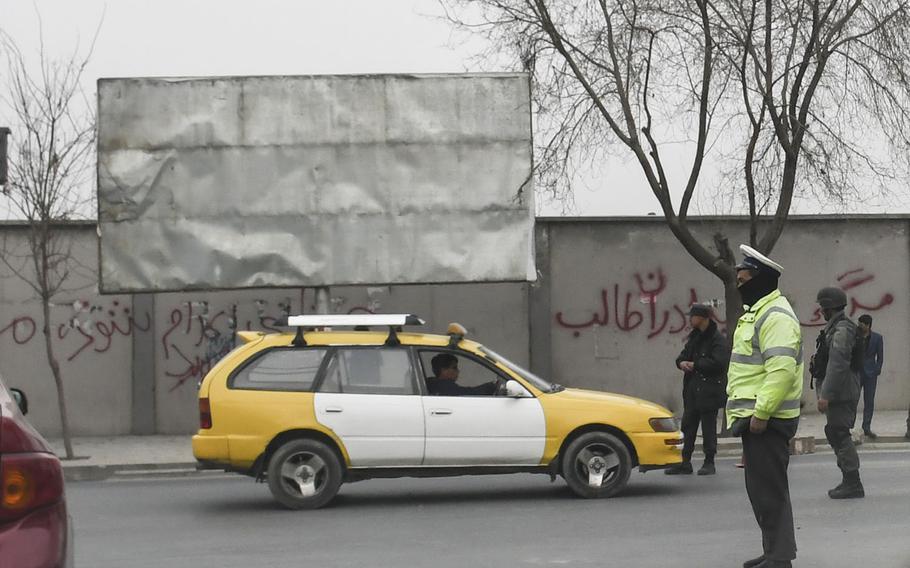 Traffic police were out in force in Kabul on Sunday, Jan. 28, 2018, the day after one of the deadliest bombings in the country since 2001. The suicide bombing, which used an ambulance laden with explosives in an area teeming with people, killed more than 100 and injured more than 200 near the old Interior Ministry building.