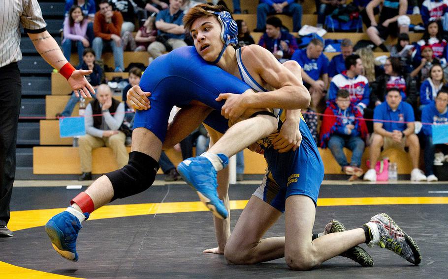 Wiesbaden's Atreyu Allen, right, tries to flip Sigonella's Munro Manning during the DODEA-Europe wrestling championships in Wiesbaden, Germany, on Saturday, Feb. 17, 2018. Allen defeated Manning 11-3 to win the 113-pound weight class.