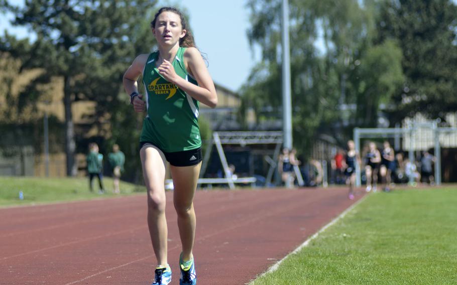 SHAPE distance standout Holly Moser finishes the final lap in the 1,600-meter run during a high school track meet at RAF Lakenheath, England, Saturday, May 19, 2018. Moser earned winning times of 5 minutes, 31 seconds in the 1,600 and 11:56 in the 3,200.