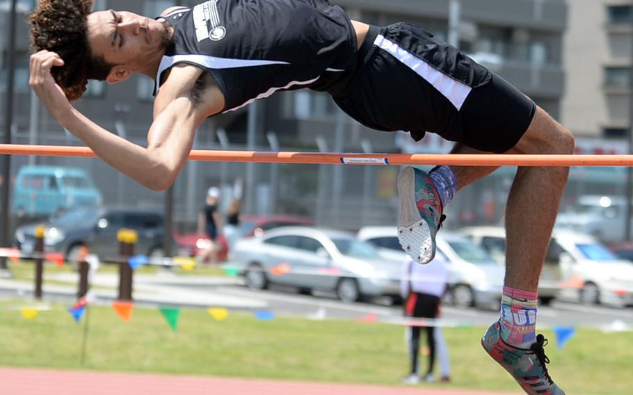 Humphreys' Quintin Metcalf clears the bar at 1.85 meters during Monday's high jump final in the Far East track and field meet. Metcalf won the Division II title.
