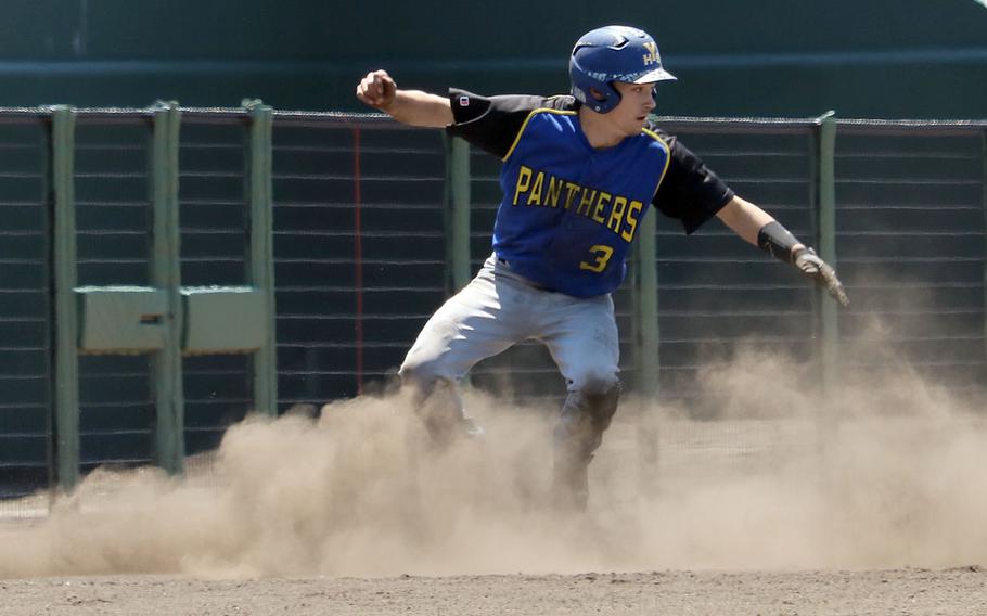 Yokota's Nick Yingling raises a cloud of dust coming around third base during Monday's double-elimination playoff game in the Far East Division II baseball tournament. The Panthers blanked Osan 11-0 as Troy Barnes threw a no-hitter.

