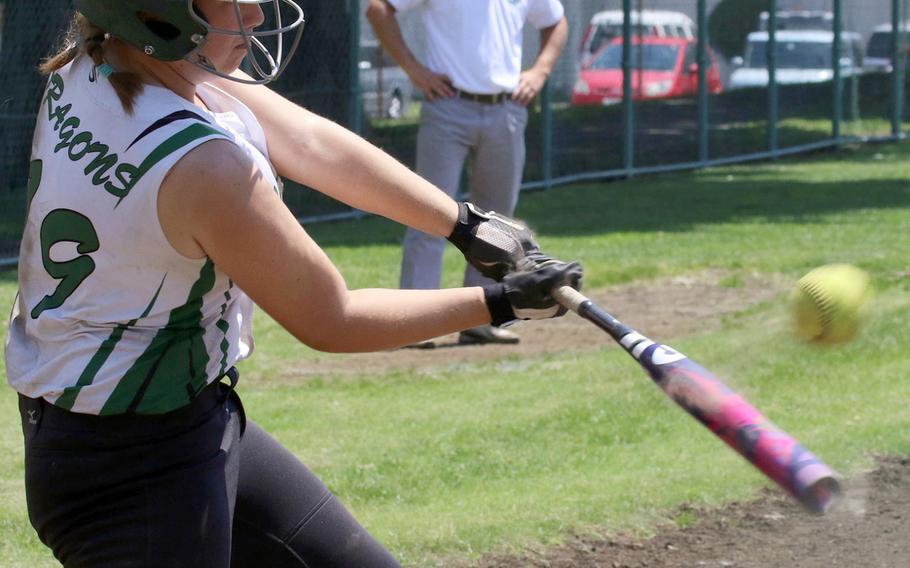 Kubasaki's Madison Richardson smacks the ball during Monday's round-robin play in the Far East Division I softball tournament. The Dragons won all three round-robin games and outscored their opponents 40-0.
