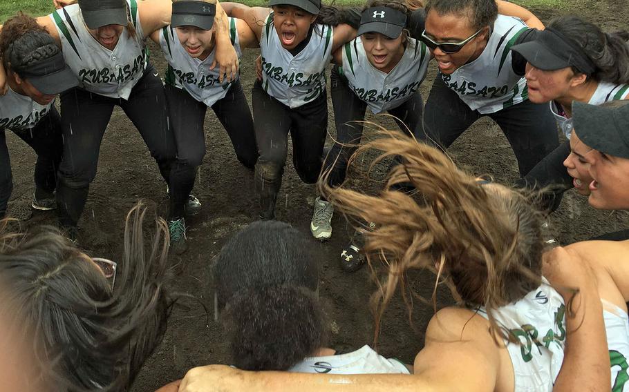 Kubasaki softball players celebrate their first Far East Division I tournament title.
