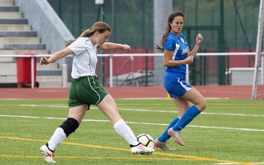 Alconbury's Laela Evans, left, shoots the ball past Sigonella's Kristiana Wyrick during the DODEA-Europe Division III soccer championship in Kaiserslautern, Germany, on Thursday, May 24, 2018.