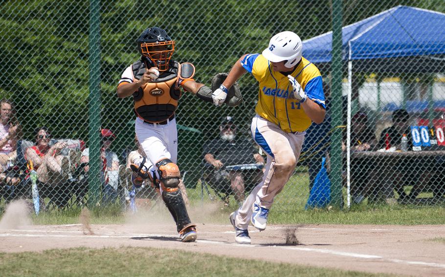 Sigonella's Alex Ogletree, right, runs to first with Spangdhalem's Deon Montgomery close behind during the DODEA-Europe Division II/III baseball championship at Ramstein Air Base, Germany, on Saturday, May 26, 2018.