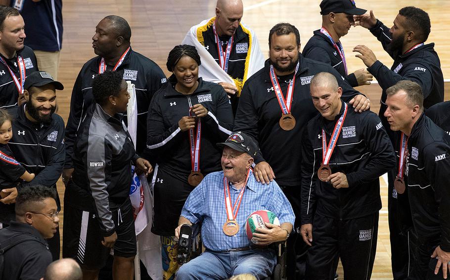 Team Army shares it’s bronze medal sitting volleyball victory with retired Col. Kenneth Boyer, a Vietnam and Korea War veteran, during the 2018 DoD Warrior Games at the Air Force Academy in Colorado Springs, Colo. June 8, 2018. 
