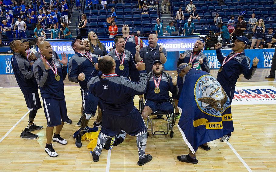 Team Navy celebrates their sitting volleyball championship win at the DoD Warrior Games, June 8, 2018, at the U.S. Air Force Academy in Colorado Springs, Colorado.