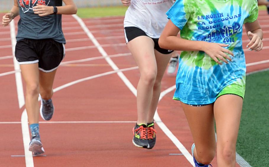 Junior Melissa Martin leads the girls pack down the home stretch of a Humphreys cross country practice. The Blackhawks field the biggest team they've had in their six school years.