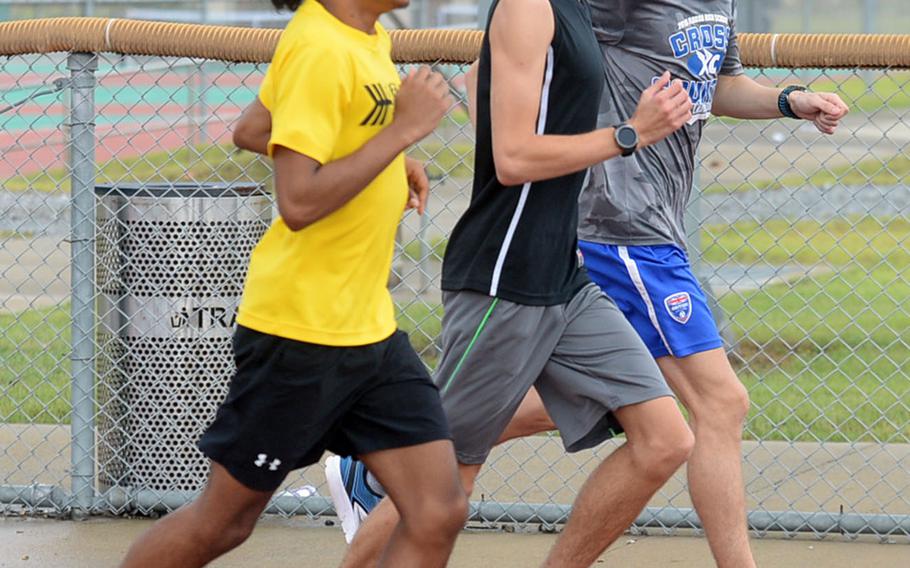 Juniors Devyn Lewis and Timothy Kilburn and senior Daniel McIntosh, a transfer from Seoul American, are among the largest cross country team in Humphreys' six years as a school.