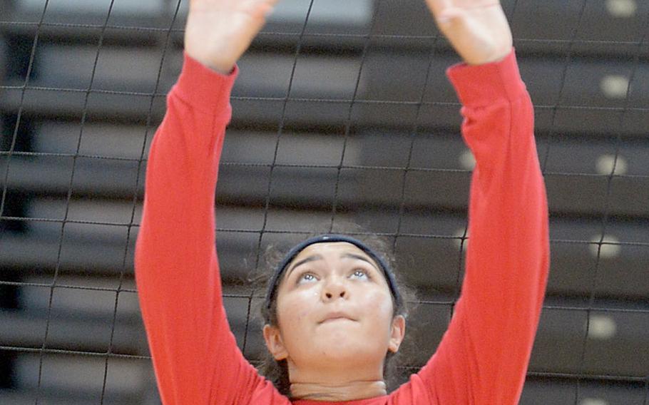 Junior Tori Osterbrink works on setting during Nile C. Kinnick volleyball practice. The Red Devils must replace departed three-year starting setter Faith Hughes.