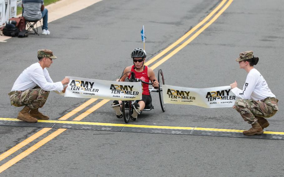 Tisha Knickerbocker crosses the finish line at the 2018 Army Ten-Miler held in Washington, D.C., on Sunday, Oct. 7, 2018.