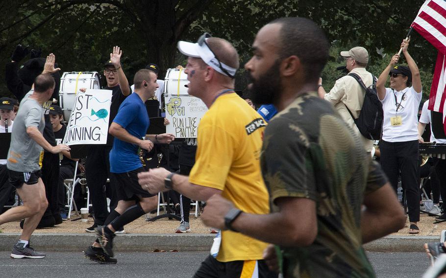 Band members from Pope Paul VI High School in Fairfax, Va., cheer on the runners during the Army Ten-Miler in Washington, D.C., Oct. 7, 2018.