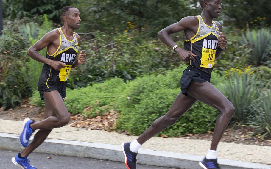 Eventual winner Frankline Tonui trails fellow World Class Athlete Program runner Evans Kirwa, who would go on to finish second, near the six-mile mark of the Army Ten-Miler in Washington, D.C., Oct. 7, 2018.