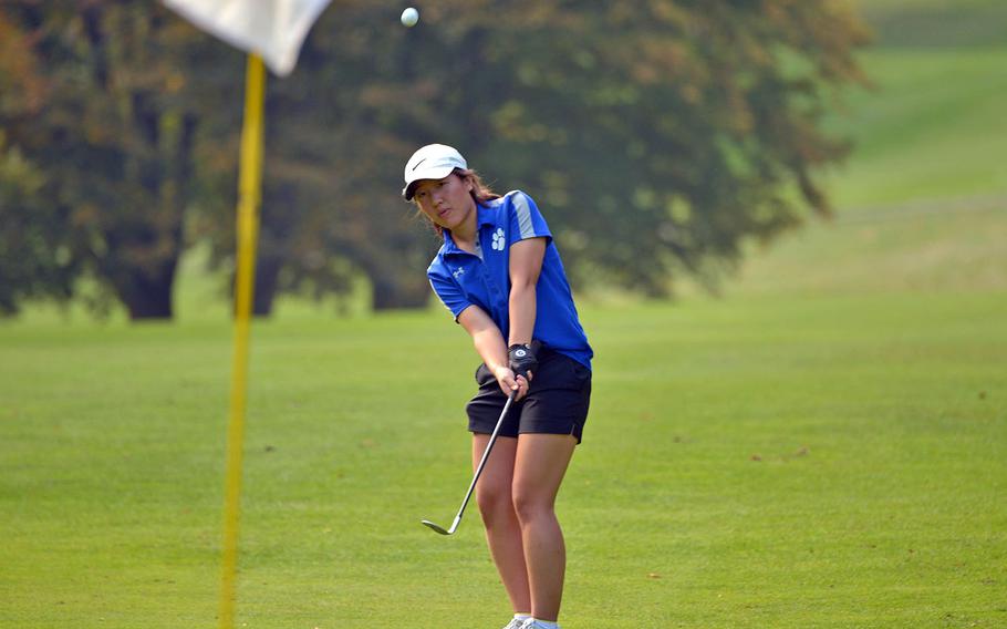 The new DODEA-Europe girls golf champion, Phoebe Shin of Ramstein, watches her chip head towards the pin during the final round of the golf championships at Rheinblick Golf Course inWiesbaden, Germany, Thursday, Oct. 11, 2018. She scored a Stableford 74 over two rounds for the win.