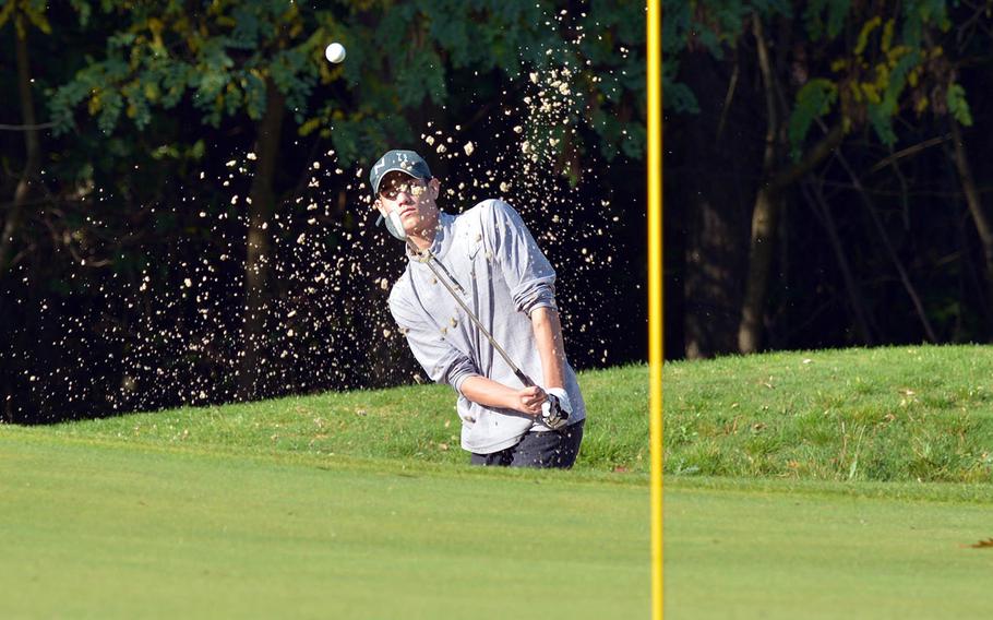 Sand flies as Alexander Hauser of Naples hits out of a trap during final round action at the DODEA-Europe golf championships at Rheinblick Golf Course in Wiesbaden, Germany, Thursday, Oct. 11, 2018. 