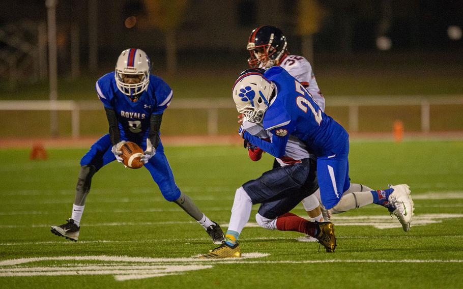 Miguel Smith of Ramstein picks up a fumbled punt return during the DODEA-Europe Division I football championship game between the Ramstein Royals and the Lakenheath Lancers, Saturday, Nov. 3, 2018. 
