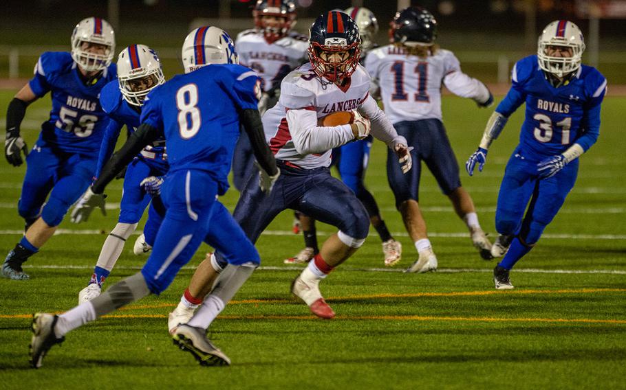 Ion Duenas of Lakenheath tries to avoid a tackle during the DODEA-Europe Division I football championship game between the Ramstein Royals and the Lakenheath Lancers, Saturday, Nov. 3, 2018. 