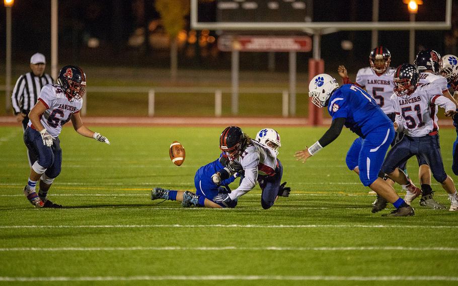 Players scramble for the ball after a Lakenheath fumble during the DODEA-Europe Division I football championship game between the Ramstein Royals and the Lakenheath Lancers, Saturday, Nov. 3, 2018. 