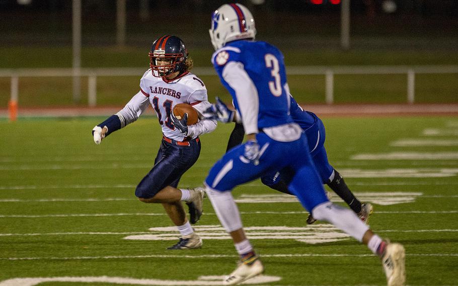 Ethan Smith of Lakenheath runs for a first down during the DODEA-Europe Division I football championship game between the Ramstein Royals and the Lakenheath Lancers, Saturday, Nov. 3, 2018. 