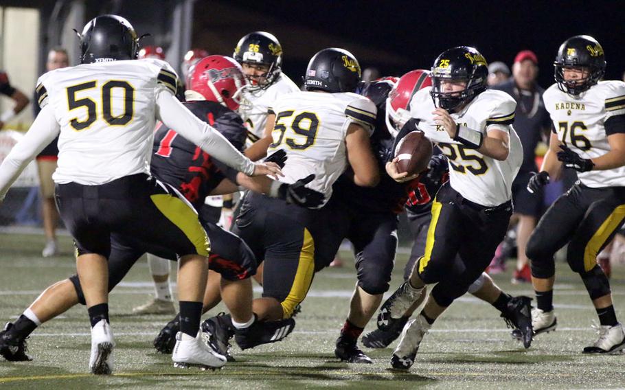 Kadena quarterback Wyatt Knopp looks for running room.